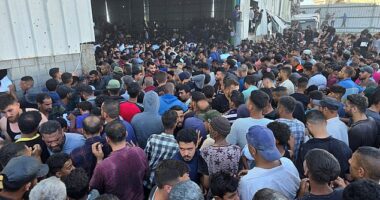 Heartbreaking footage of the crush showed frenzied Gazans tearing pieces off the building located in Deir Al-Balah in an attempt to get at the supplies inside