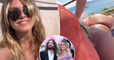 Heidi Klum sunbathes in thong bikini as husband Tom Kaulitz massages her butt