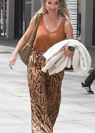 Helen Skelton looked stylish in tiger print trousers as she left the BBC studios separately to Gethin Jones as they try to keep their 'deeper connection' under wraps