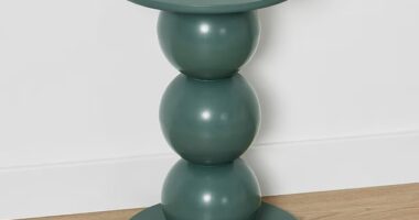 The Kmart design looks almost identical to the extremely expensive designer $16,436 Dança Side Table by Gabriela Campos [pictured]