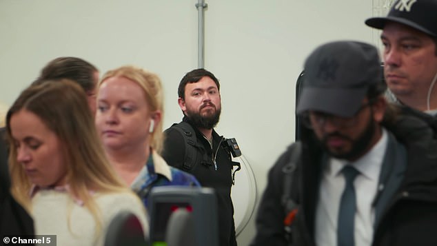 TfL has an army of 500 revenue officers and a team of crack investigators tackling fare evasion (pictured: a plainclothes inspector watches fare-paying passengers pass through at Forest Green station)