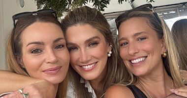 Delat Goodrem (centre), who is set to tie the knot to rockstar Matt Copely this year, celebrated her upcoming nuptials with her nearest and dearest with a boat party and sundowners at a glitzy beachside restaurant