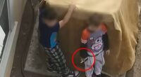 New Mexico police officers were forced to confront two young boys aged just seven and nine-years-old after they refused to drop a handgun