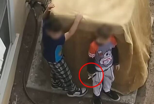 New Mexico police officers were forced to confront two young boys aged just seven and nine-years-old after they refused to drop a handgun