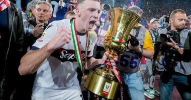 Ferguson celebrates with the Italian Cup after a memorable night in Rome's Stadio Olimpico