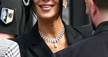 Kim Kardashian sported a lavish diamond necklace and earrings as she prepared to testify at the trial of a gang accused of robbing her at gunpoint in her Paris hotel room in 2016