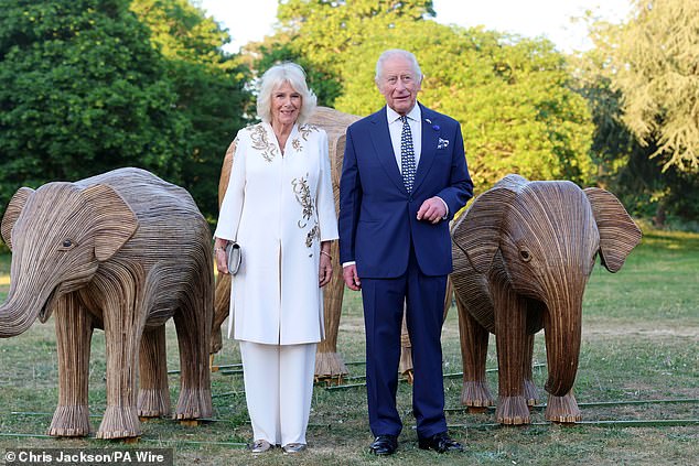 Charles and Queen Camilla are pictured attending the Elephant Family Evening of Art and Conservation at Kew Gardens on Tuesday evening