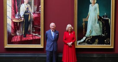 The King and Queen pose with their official Coronation state portraits at the National Gallery