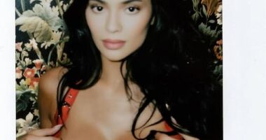 Kylie put on a busty display in a fire engine red bra at the event