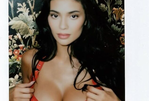 Kylie put on a busty display in a fire engine red bra at the event
