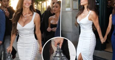 Lauren Sánchez pairs $6,000 Eiffel Tower purse with bridal-white corset and lace-up skirt during Paris bachelorette