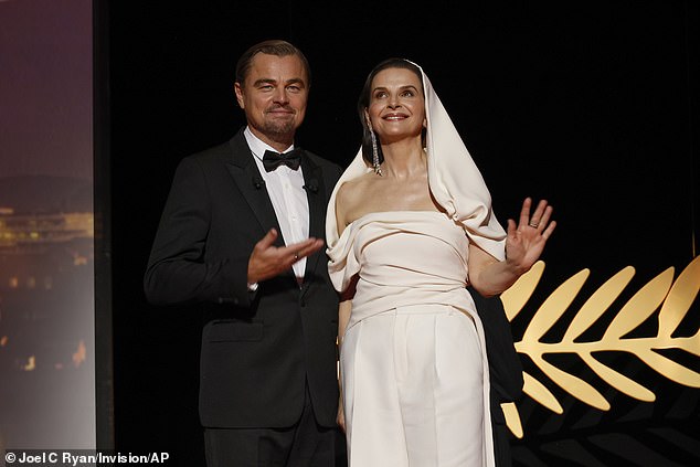 Leonardo Di Caprio was joined by Juliette Binoche as he presented his close friend Robert De Niro with the the honorary Palme d'Or award at the 78th Cannes Film Festival on Tuesday