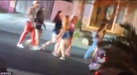 Footage showed a wave of young people emerging from Lewis' home after police showed up, after they were seen dancing on her countertops and destroying her home decor
