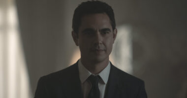 Max Minghella wearing a black suit and tie and white shirt in The Handmaid's Tale season 6