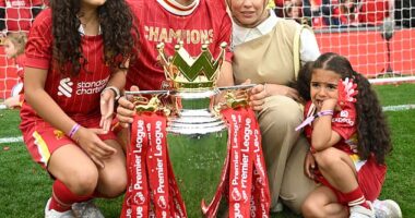 Mo Salah is pictured with his wife Magi Salah and their children Makka (left) and Kayan (right) on Sunday as Liverpool celebrates winning the Premier League
