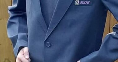 A mother has criticised her child's school's 'archaic' uniform rules which require students to wear woolly jumpers in the sweltering hot summer sun
