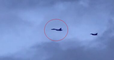 A Russian Su-35 fighter jet, followed by a Polish Air Force MiG-29 pictured over the Jaguar oil tanker