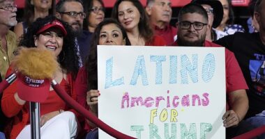 A former advisor to Barack Obama has warned the Democrats have 'no path' back to the White House unless they win back Latino voters. (Pictured: Supporters hold a sign as Donald Trump arrived to speak during a campaign event in Tucson, Arizona on September 12, 2024)