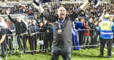Falkirk manager John McGlynn celebrates his side's Friday night promotion party