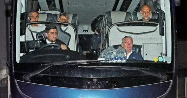 Pep Guardiola (top right) cut a frustrated figure as he arrived back in Manchester with his City team after the FA Cup final
