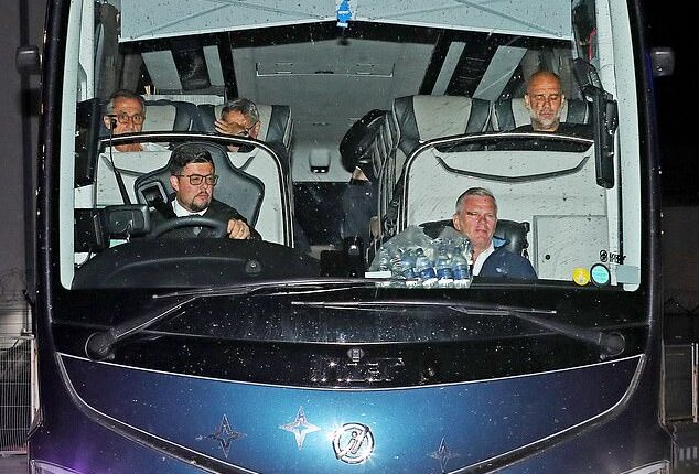 Pep Guardiola (top right) cut a frustrated figure as he arrived back in Manchester with his City team after the FA Cup final