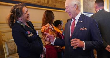 King Charles appeared in good spirits as he spoke to guests at a Windsor Castle reception for members of the Victoria Cross and George Cross Association today