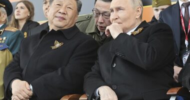 Russian President Vladimir Putin, right, and Chinese President Xi Jinping watch the Victory Day military parade in Moscow, Russia, Friday, May 9, 2025