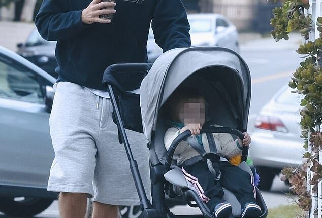 Robert Pattinson was spotted throwing himself into daddy duty as he surfaced with his baby daughter in Los Angeles this week
