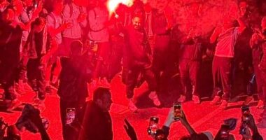 Roberto De Zerbi was seen waving a flare with Marseille fans during a wild street party at 4am