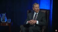 John Roberts speaking at an event.