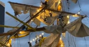 In multiple eyewitness videos, the towering masts are seen snapping and partially collapsing as they crash into the bridge's deck