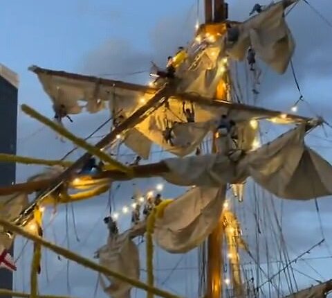 In multiple eyewitness videos, the towering masts are seen snapping and partially collapsing as they crash into the bridge's deck