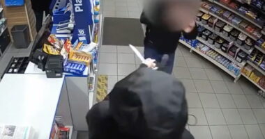 Shop worker confronts knife-wielding robber with bare hands after female colleague threatened