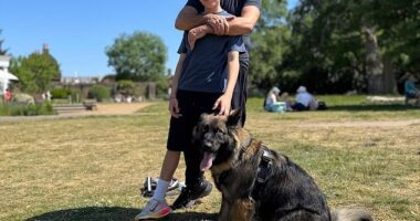 Simon Cowell looked happier than ever on Sunday as he sweetly hugged lookalike son Eric during a sun-soaked dog walk