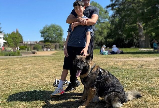 Simon Cowell looked happier than ever on Sunday as he sweetly hugged lookalike son Eric during a sun-soaked dog walk