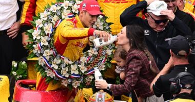 Chip Ganassi Racing driver Alex Palou (10) of Spain celebrates with his family in the winner's circle after winning the 109th Running of the Indianapolis 500 at Indianapolis Motor Speedway