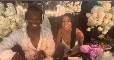 Their first meal as husband and wife: Travis Hunter and his bride Leanna Lenee are all smiles