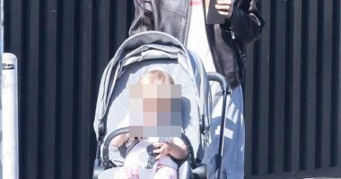 Suki Waterhouse dressed down for a sunny stroll with her 14-month-old daughter in Los Angeles on Monday morning