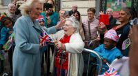 Queen Camilla was greeted by an excited supporter in Bradford as King Charles was wowed by magician Steven Frayne's impressive tricks
