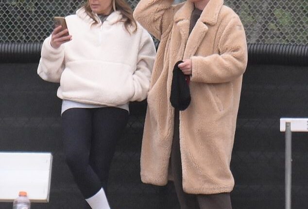 Teddi Mellencamp, 43,  bundled up in the cold as she and another mom watched their sons play football Saturday in Los Angeles