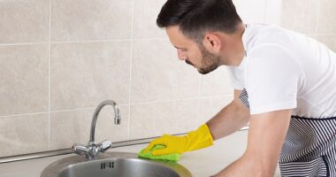 Kitchen counters, sinks, and sponges can harbor countless pathogens due to poor cleaning habits and cross-contamination between different foods being prepared (Stock image)