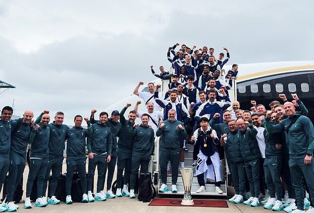 Tottenham smiled for a team photo after landing in England with the Europa League trophy