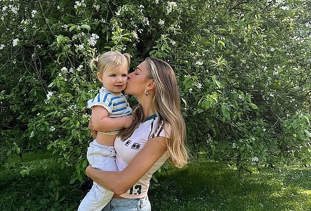 Zara McDermott, 28, cuddled into her friend's daughter (pictured) as she enjoyed the May Bank Holiday weekend after her ex Sam Thompson confirmed he has moved on with a new woman