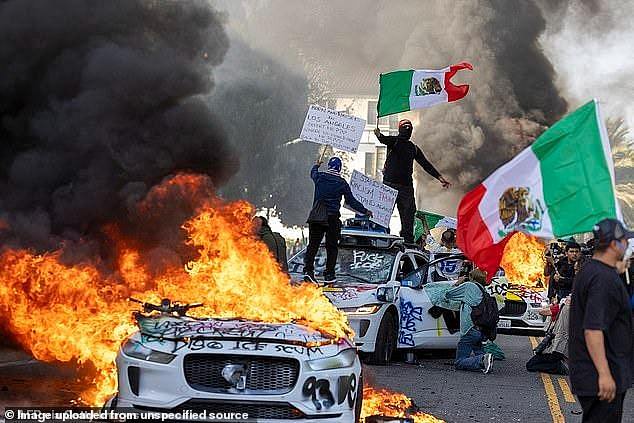 Rioters have set fire to driverless cars and been pictured waving Mexican flags and anti-ICE placards in LA