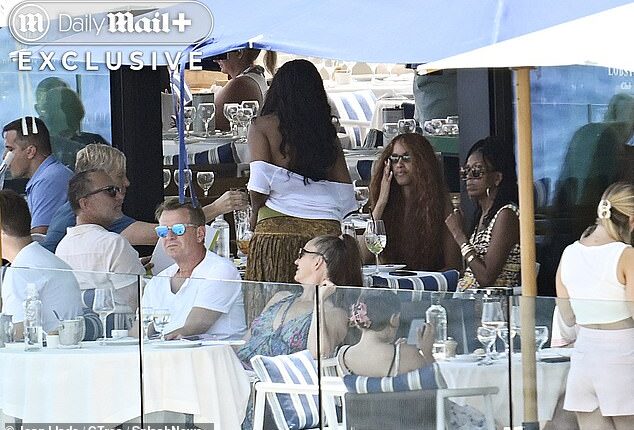 Michelle Obama and her daughters were pictured enjoying lunch at an exclusive club on the idyllic Spanish island of Mallorca.