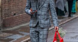 One man is pictured wearing a box over his head the morning after the Trinity Ball at Cambridge