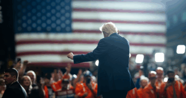 Trump dancing with American flag in the background