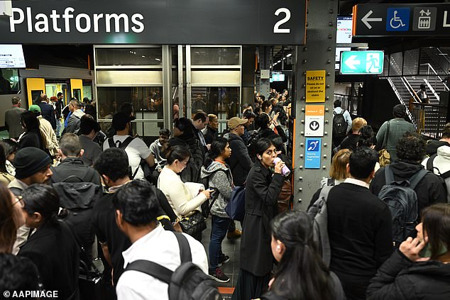 Australia's economic output is going backwards again in a clear sign the country is less productive as immigration soars (pictured is Sydney's Town Hall train station)
