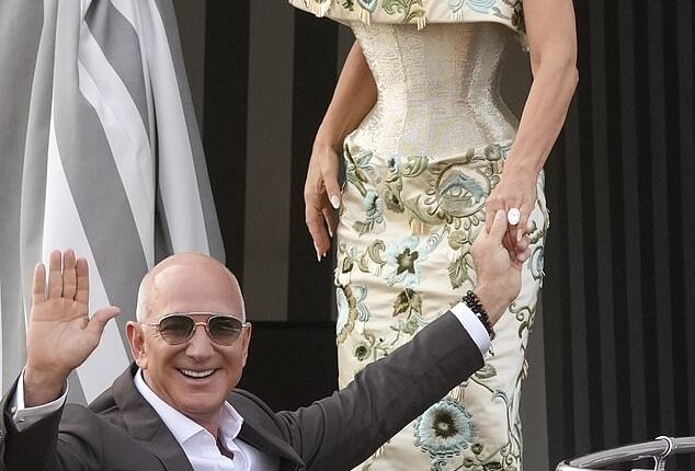 Here comes the bride! The soon-to-be Mrs. Bezos looked beautiful as she stepped into a water taxi with future husband Jeff on Thursday evening to head to the latest festivities. She wore a curve-hugging, champagne-colored strapless dress from Schiaparelli's Spring 2025 couture line with blue, green and gold embroidery all over it. She matched the dress with a pair of dark-champagne colored pumps, and kept things minimal with classic stud earrings