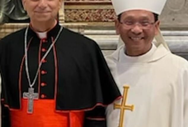 Bishop Michael Pham (right) of the Diocese of San Diego poses for a photo with then Cardinal Robert Francis Prevost before he became Pope Leo. The pontiff elevated Pham to the position of bishop in May